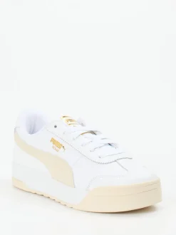 Puma – Sneaker aus Glattleder in Weiß mit Goldakzenten