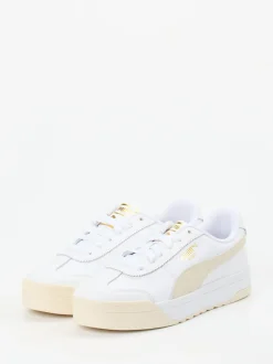 Puma – Sneaker aus Glattleder in Weiß mit Goldakzenten