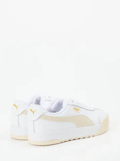 Puma – Sneaker aus Glattleder in Weiß mit Goldakzenten