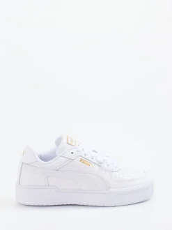 Puma – Sneaker aus Glattleder weiß mit Golddetails