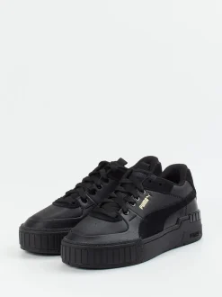 Puma – Sneaker aus Leder in Schwarz mit Goldakzenten