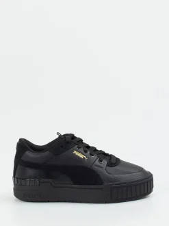 Puma – Sneaker aus Leder in Schwarz mit Goldakzenten
