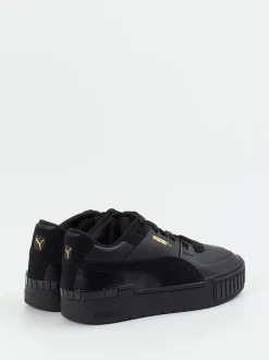 Puma – Sneaker aus Leder in Schwarz mit Goldakzenten