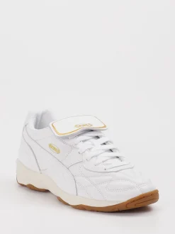Puma – Sneaker aus Leder in Weiß mit Gold-Detail