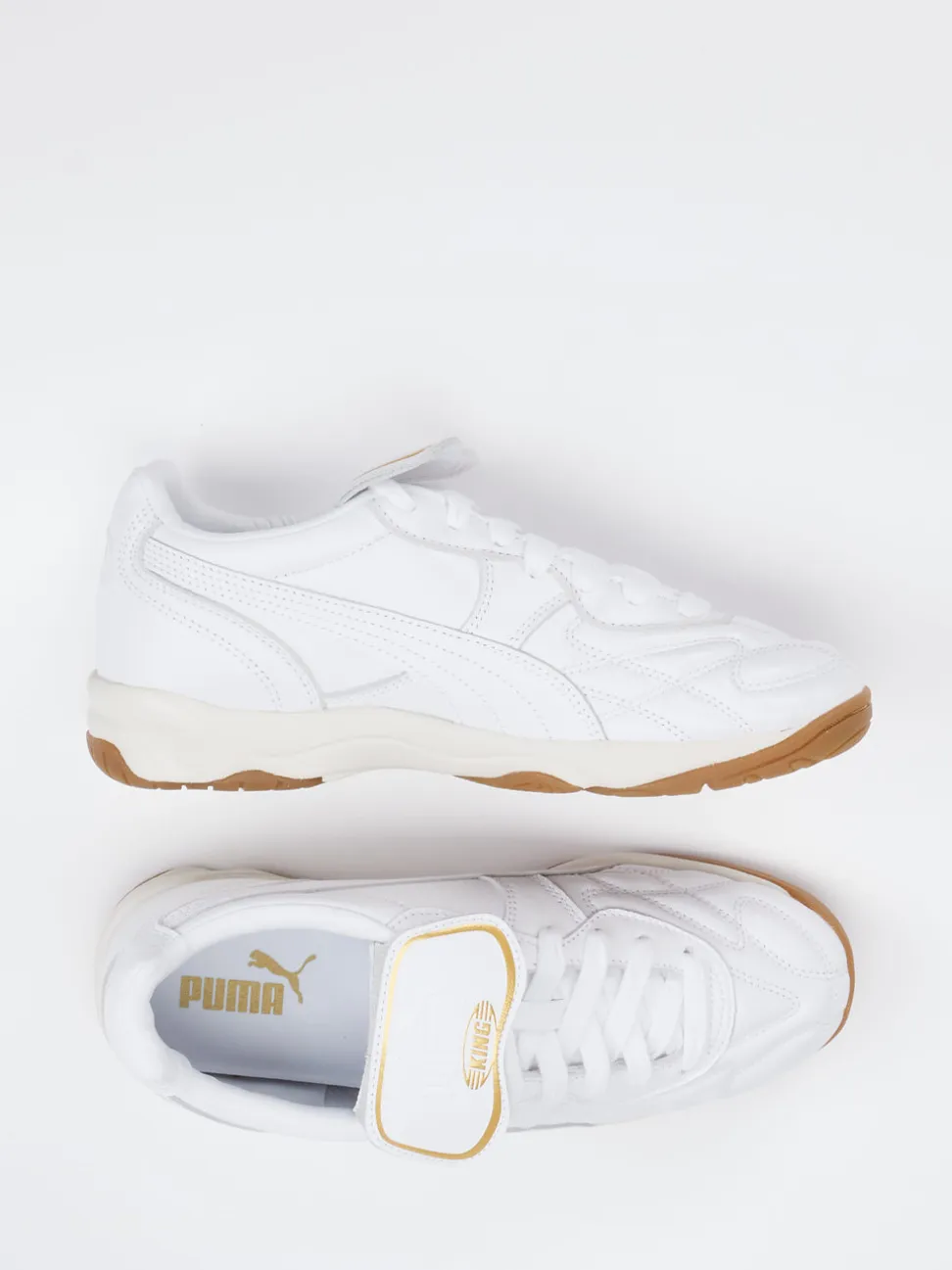 Puma – Sneaker aus Leder in Weiß mit Gold-Detail