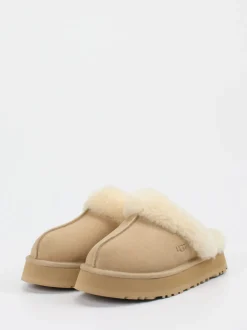 UGG – Lammfell-Pantoffeln aus Veloursleder Beigebraun