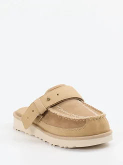 UGG – Mules aus Veloursleder mit Lammfellfutter