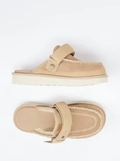 UGG – Mules aus Veloursleder mit Lammfellfutter
