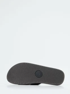 UGG – Slides aus Veloursleder in Schwarz